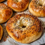 Cottage Cheese Bagels: 5-Min Irresistibly Easy High-Protein Delight 6 Freshly baked cottage cheese bagels on parchment paper
